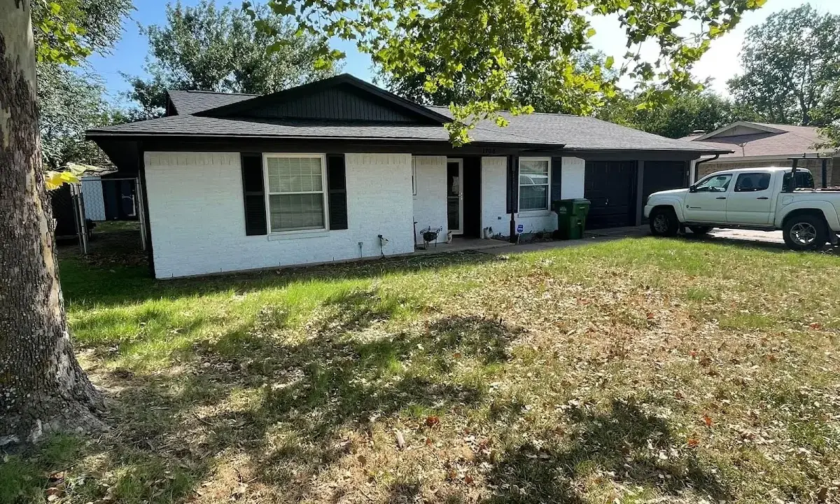 Professional roofing crew working on a residential roof in Epping
